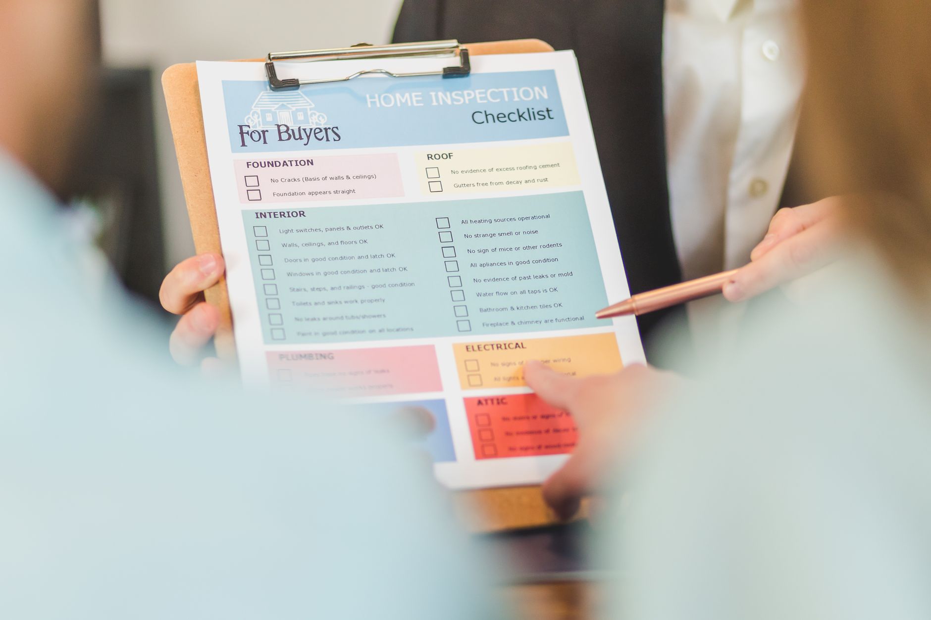 Clipboard with a cleaning checklist beside cleaning supplies
