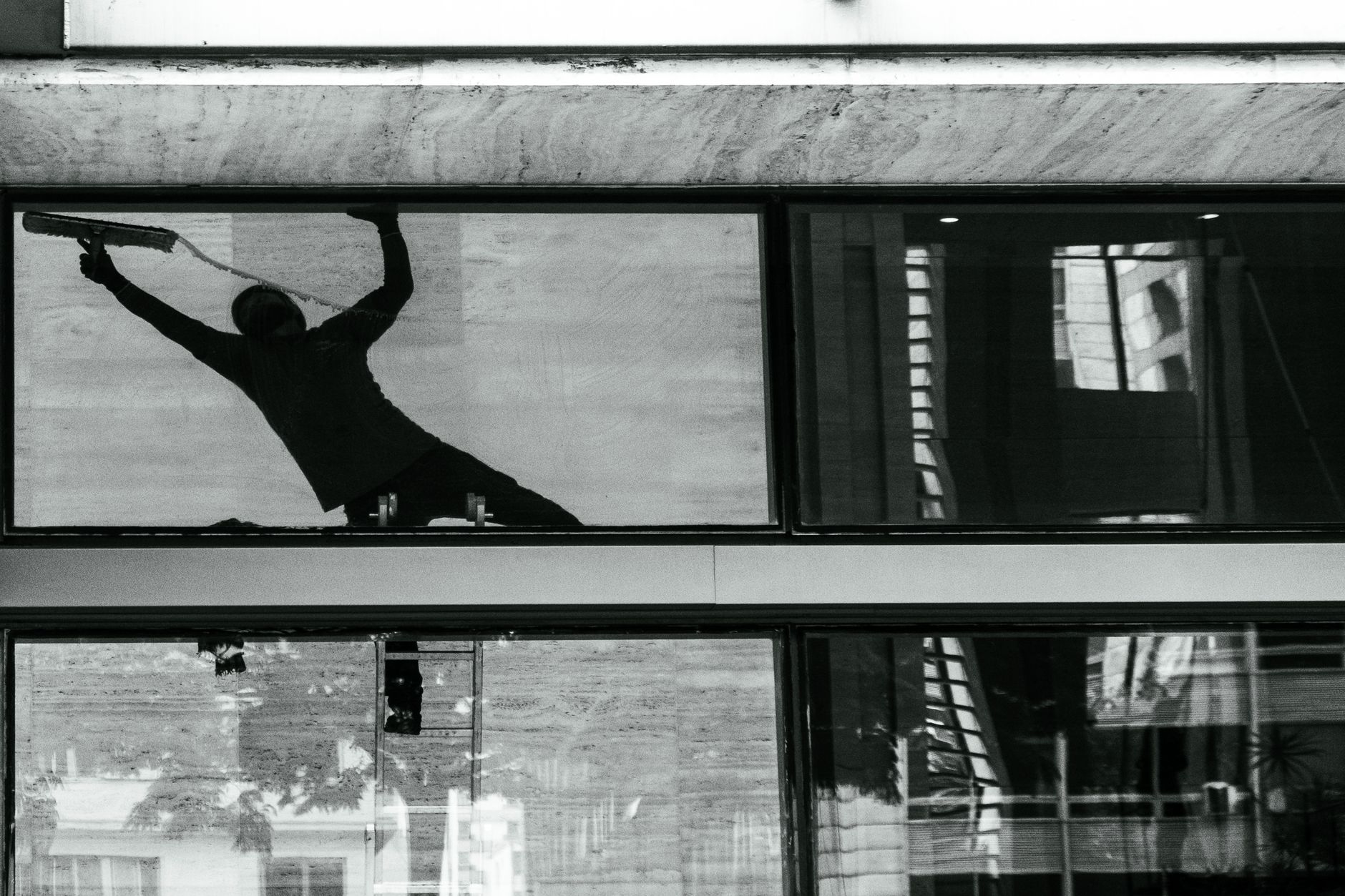 Professional window cleaning with squeegee